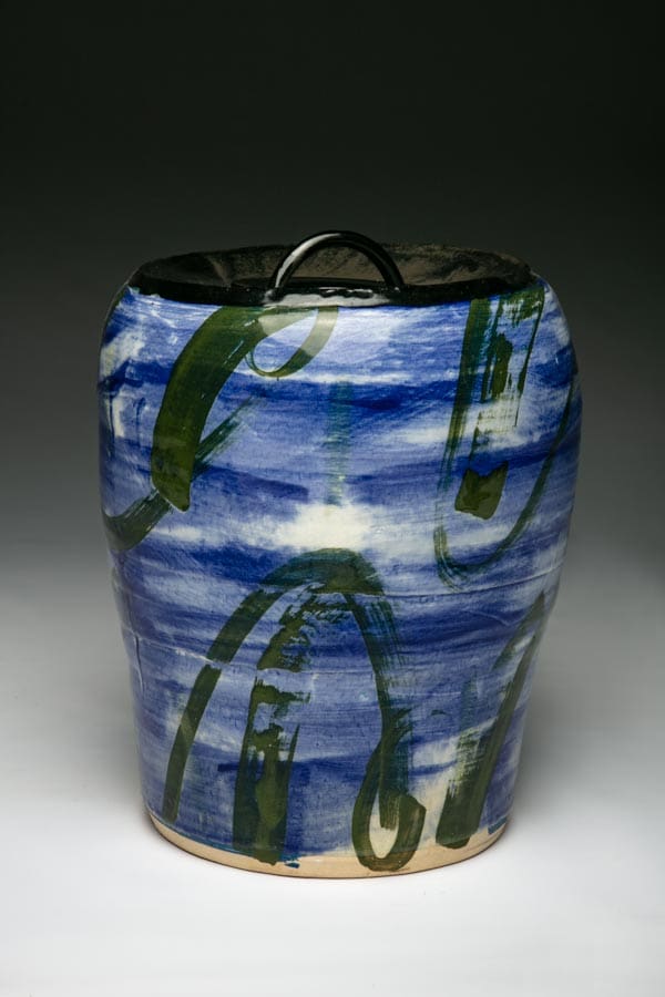Lidded Jar, 1999 is washed blue with black swaths